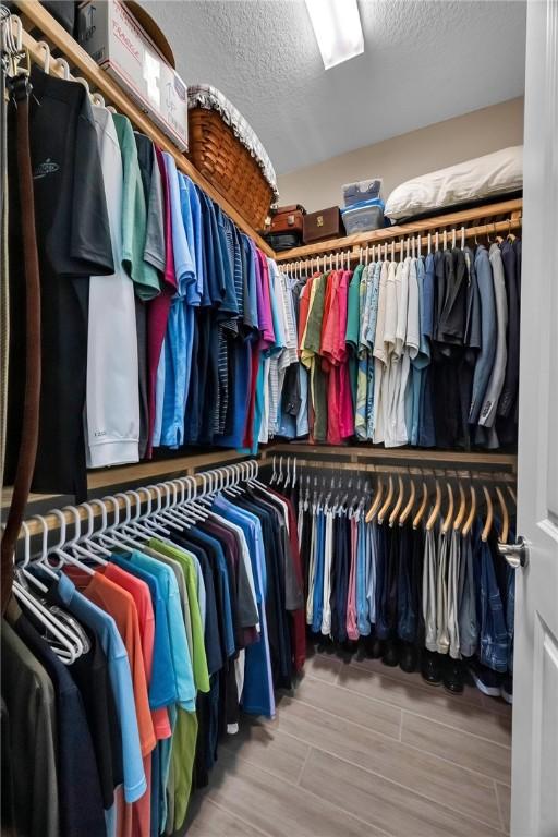 spacious closet featuring wood finished floors