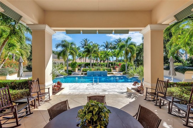 view of swimming pool featuring a patio area and pool water feature