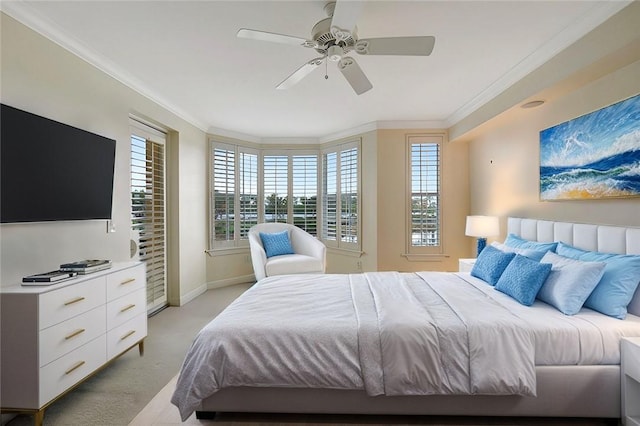 9013 Somerset Bay Ln Unit 201, Vero Beach, FL 32963 - bedroom with crown molding, multiple windows, baseboards, light colored carpet, and ceiling fan