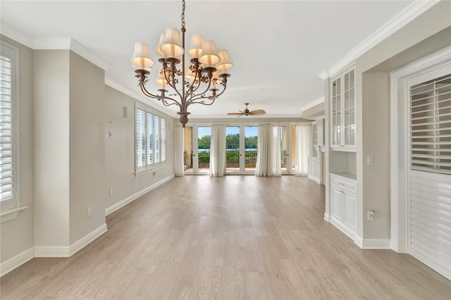 unfurnished living room with french doors, light wood-type flooring, ceiling fan with notable chandelier, and ornamental molding