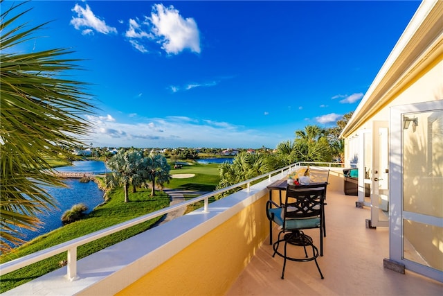 balcony featuring a water view