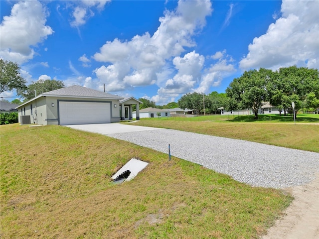 view of front of home featuring a garage and a front yard