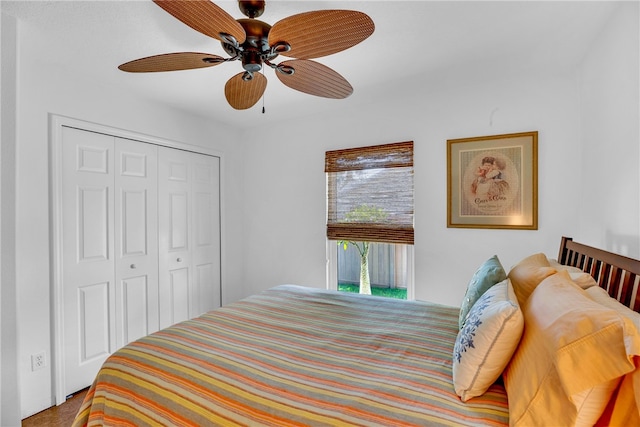 carpeted bedroom with ceiling fan and a closet