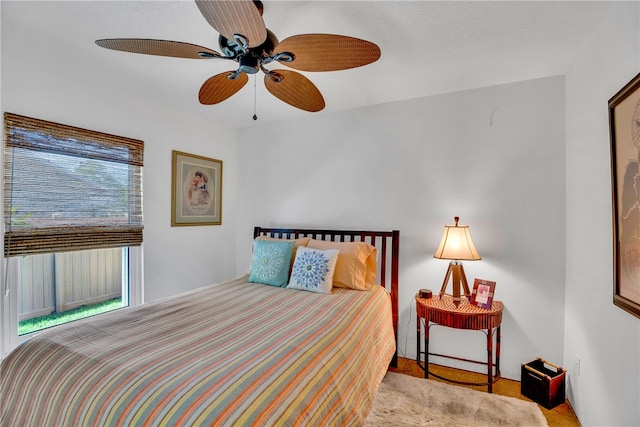 carpeted bedroom with ceiling fan