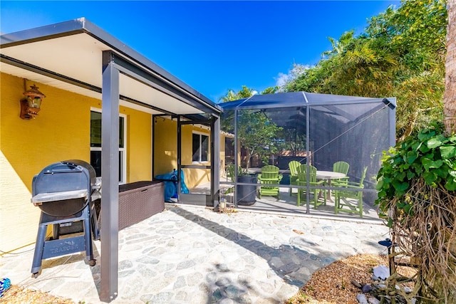 view of patio / terrace with a lanai