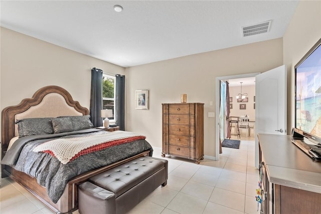 5744 Cahaba St, Port St Lucie, FL 34986 - bedroom featuring light tile patterned floors and a chandelier