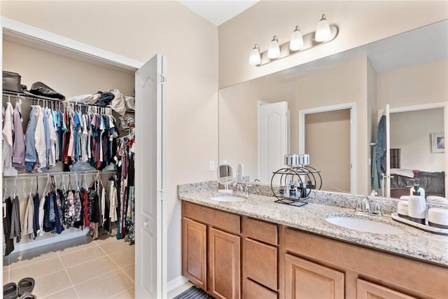 5744 Cahaba St, Port St Lucie, FL 34986 - full bathroom with double vanity, tile patterned floors, and a walk in closet