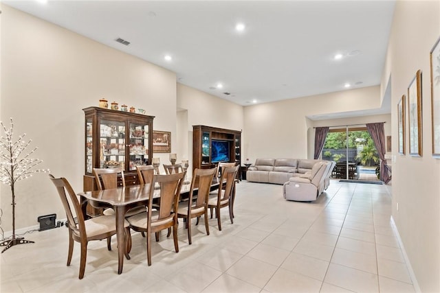 5744 Cahaba St, Port St Lucie, FL 34986 - dining room featuring light tile patterned floors, recessed lighting, and a high ceiling