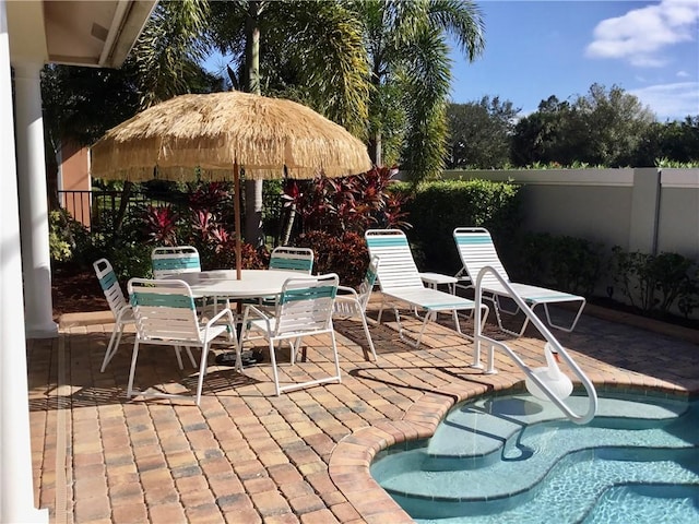 view of patio featuring a pool