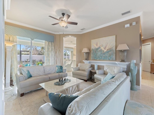 tiled living room with plenty of natural light, ceiling fan, and ornamental molding