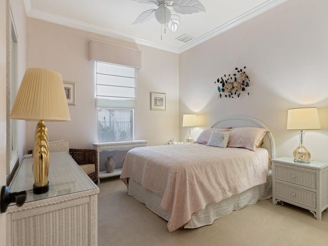 bedroom featuring light colored carpet, ceiling fan, and crown molding