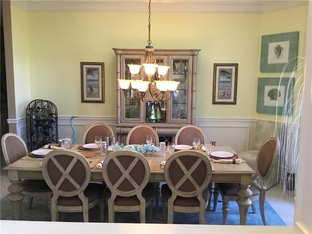 dining space featuring a notable chandelier