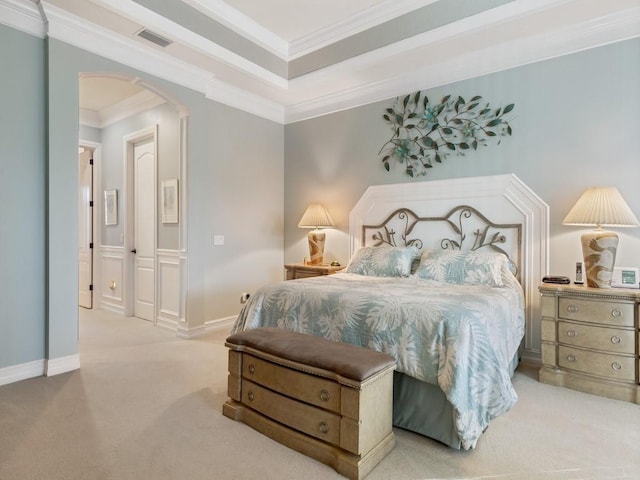 bedroom with light carpet and ornamental molding