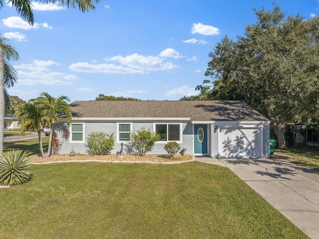 ranch-style home featuring a front lawn and a garage