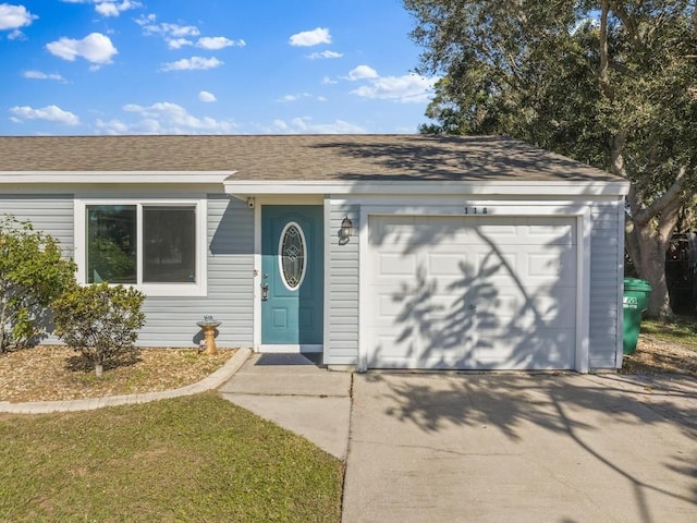 ranch-style home with a garage