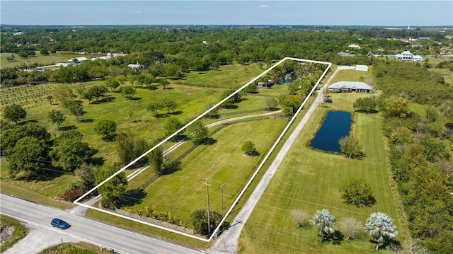 drone / aerial view featuring a water view and a rural view