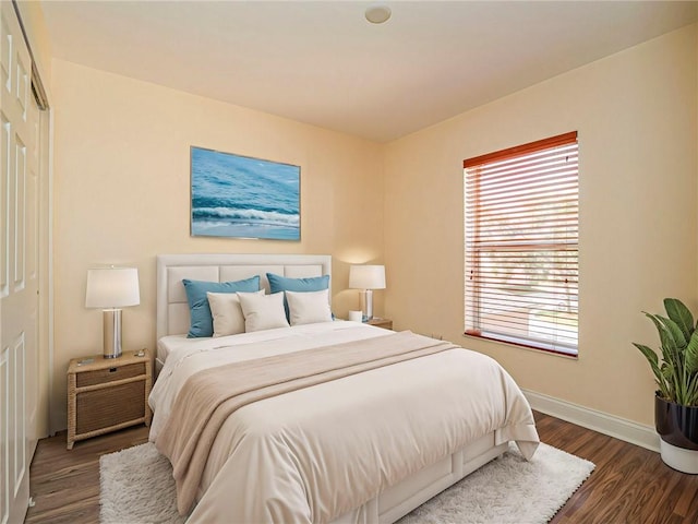 bedroom featuring dark hardwood / wood-style flooring