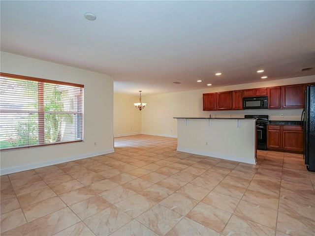 kitchen with a kitchen breakfast bar, a center island, a notable chandelier, black appliances, and decorative light fixtures