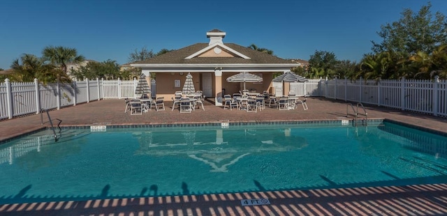 view of swimming pool with a patio area