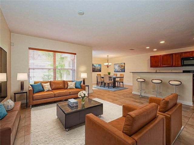 tiled living room featuring a notable chandelier