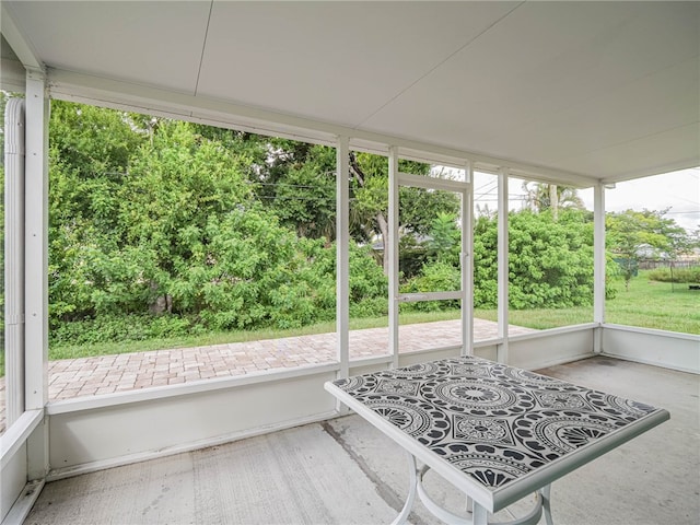 unfurnished sunroom featuring plenty of natural light