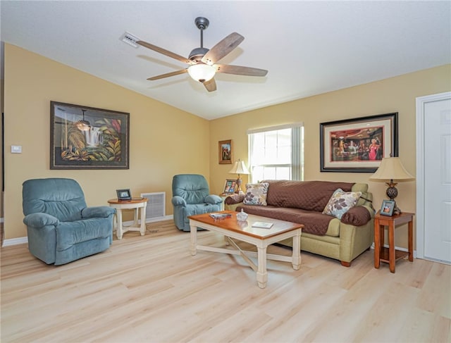 living room with light wood-type flooring, lofted ceiling, and ceiling fan