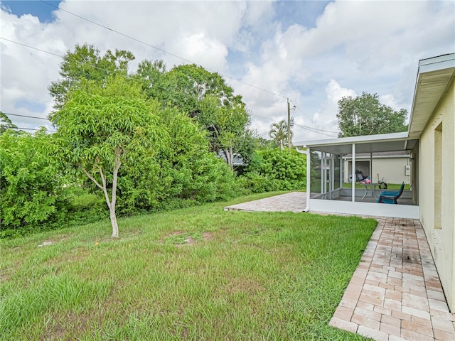 view of yard with a patio and a sunroom