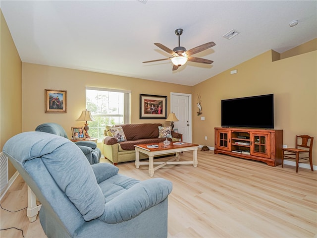 living room with light hardwood / wood-style flooring, ceiling fan, and vaulted ceiling