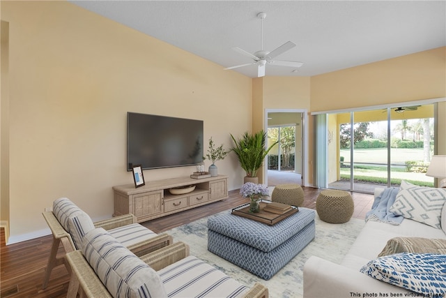 living room featuring ceiling fan and wood-type flooring