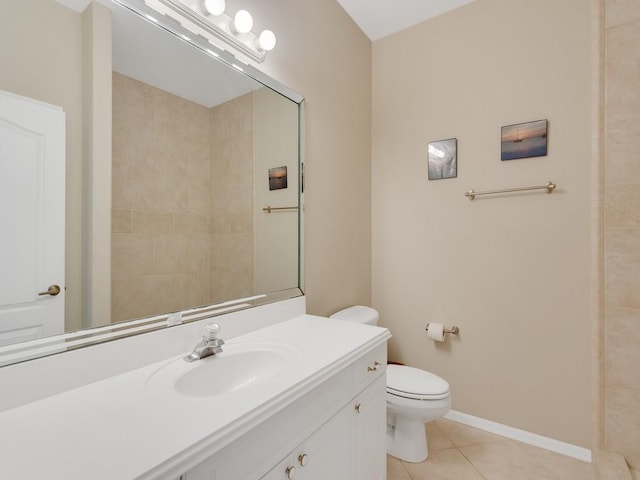 full bathroom with toilet, tile patterned floors, baseboards, and vanity
