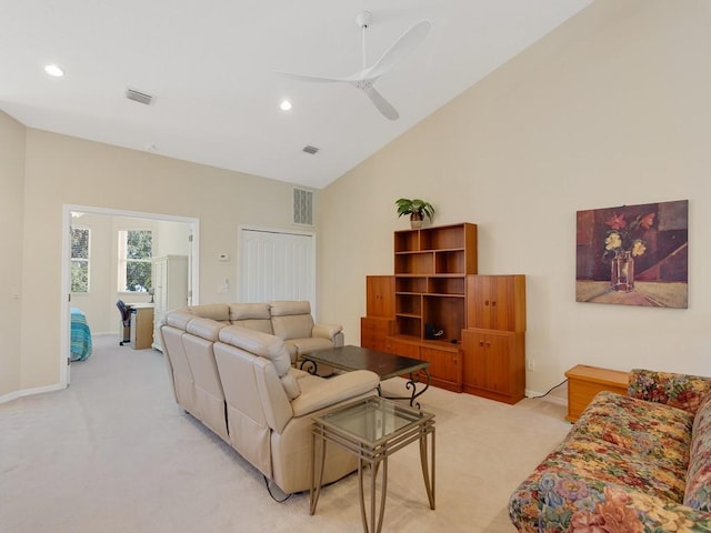 living room with recessed lighting, visible vents, and light carpet