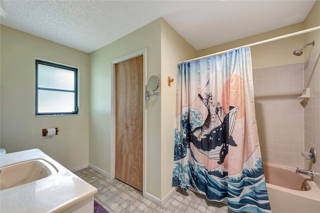 bathroom with vanity, a textured ceiling, and shower / bathtub combination with curtain