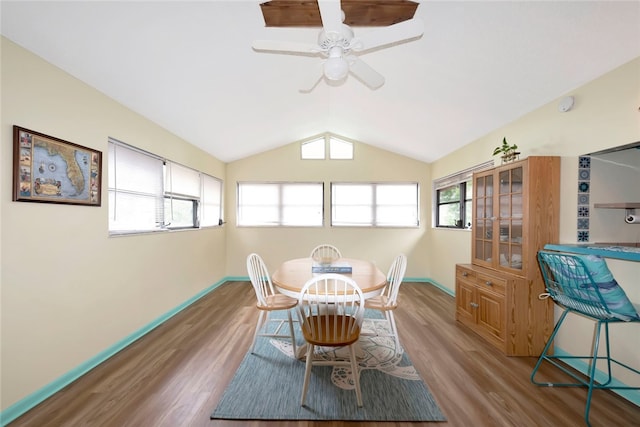 dining space featuring light hardwood / wood-style floors, ceiling fan, and vaulted ceiling