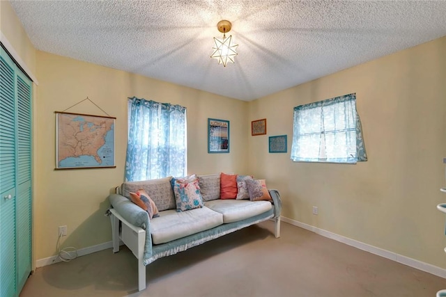 1514 Crowberry Ln, Sebastian, FL 32958 - living area featuring a textured ceiling and carpet flooring