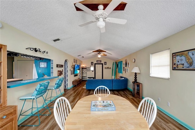 1514 Crowberry Ln, Sebastian, FL 32958 - dining space with ceiling fan, wood finished floors, a textured ceiling, and vaulted ceiling