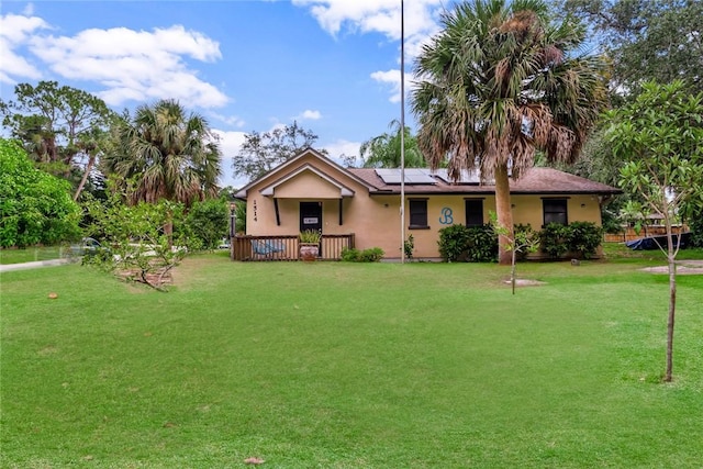 1514 Crowberry Ln, Sebastian, FL 32958 - ranch-style home featuring roof mounted solar panels, a front yard, and stucco siding