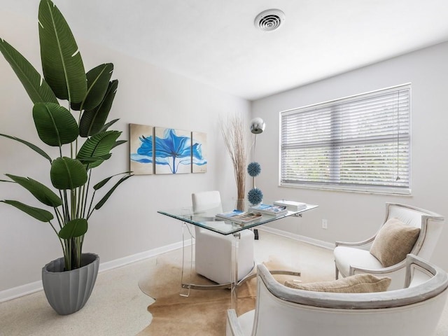 office area with visible vents and baseboards