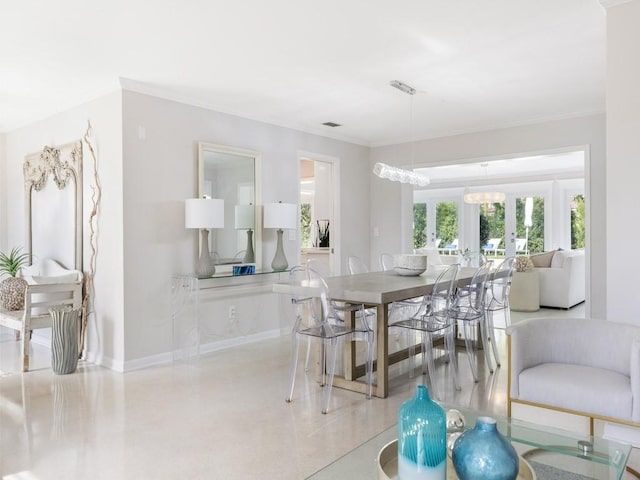 dining space featuring french doors and ornamental molding