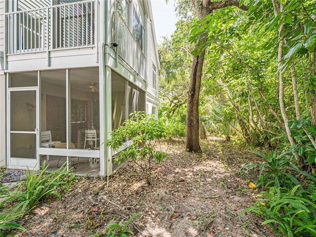 view of yard featuring a sunroom