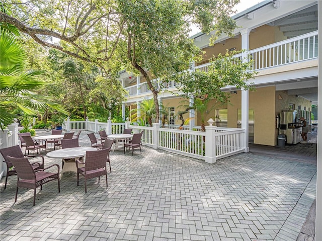 view of patio featuring a balcony