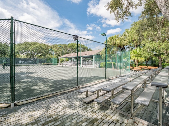 surrounding community featuring tennis court