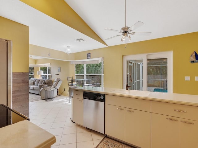 kitchen featuring sink, vaulted ceiling, light tile patterned floors, appliances with stainless steel finishes, and ceiling fan