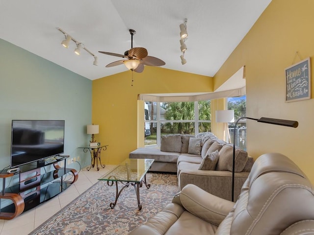 tiled living room with vaulted ceiling, rail lighting, and ceiling fan