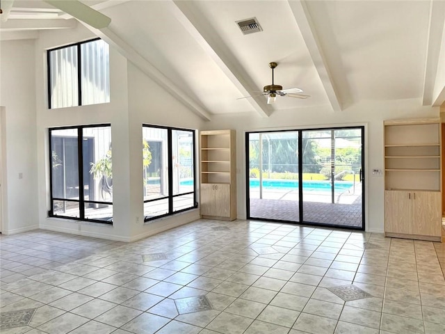 675 Colonial Dr, Vero Beach, FL 32962 - spare room featuring beam ceiling, ceiling fan, light tile patterned floors, and high vaulted ceiling
