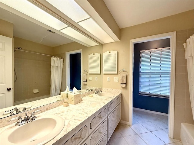 675 Colonial Dr, Vero Beach, FL 32962 - bathroom featuring double vanity and tile patterned flooring