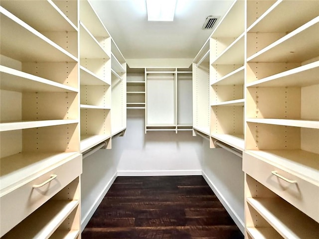 675 Colonial Dr, Vero Beach, FL 32962 - spacious closet featuring dark wood-style flooring