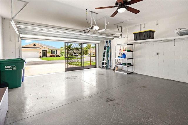 158 Port Royal Ct, Sebastian, FL 32958 - garage with concrete block wall, ceiling fan, and a garage door opener