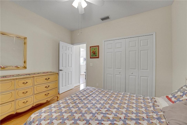 2540 46th Rd, Vero Beach, FL 32966 - bedroom featuring a closet, ceiling fan, and light wood-style floors
