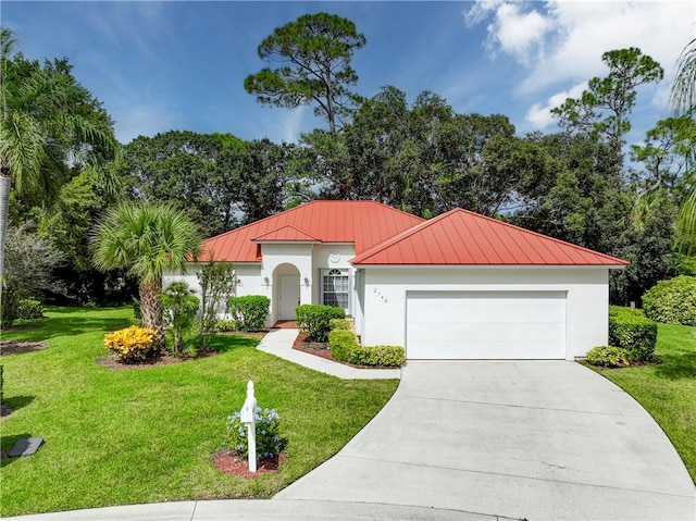 view of front facade featuring a garage and a front yard