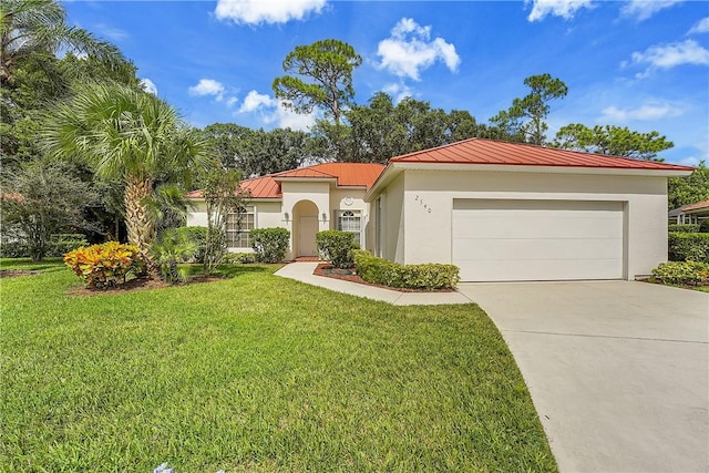 2540 46th Rd, Vero Beach, FL 32966 - mediterranean / spanish-style home with a standing seam roof, stucco siding, an attached garage, driveway, and a front lawn